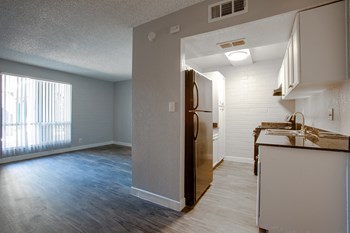Living Room and Kitchen in One Bedroom Unit at Radius Apartments - Photo Gallery 4