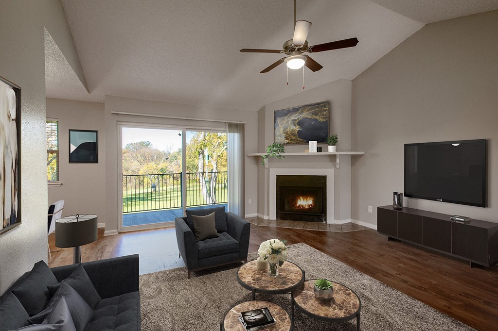 Living Room with Balcony at The Villas at Quail Creek Apartment Homes in Austin Texas
