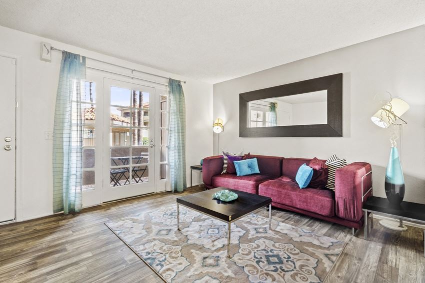 Living Room with Patio access at Zona Rio Apartments - Photo Gallery