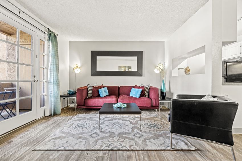 Living Room with Patio at Zona Rio Apartments - Photo Gallery