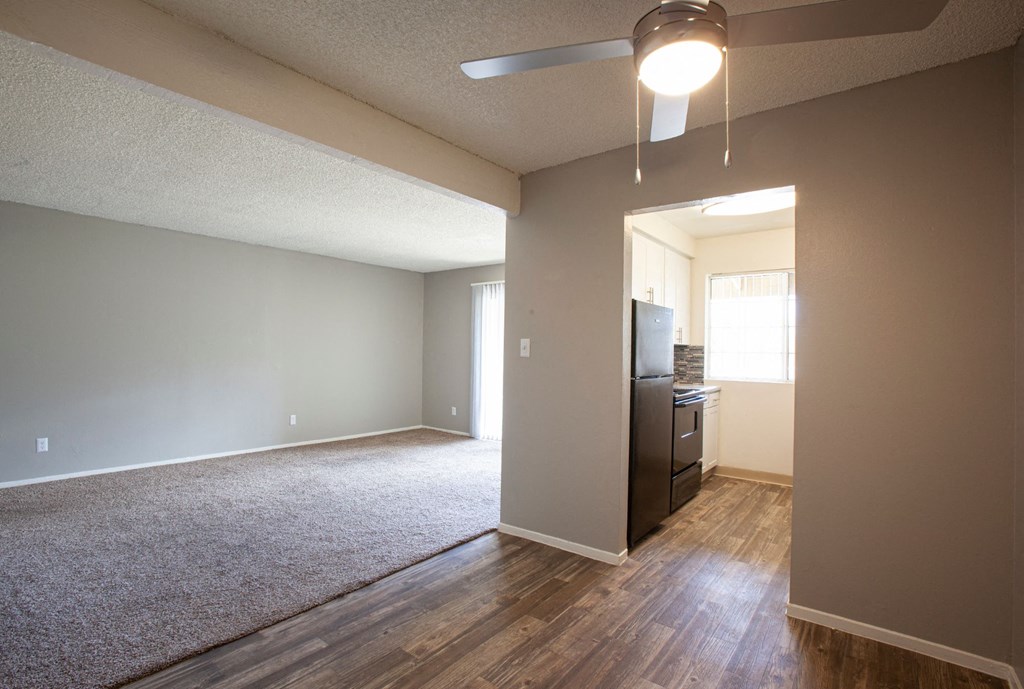 Living room and dining area at Brookwood Apartments in Tucson AZ 3-2020