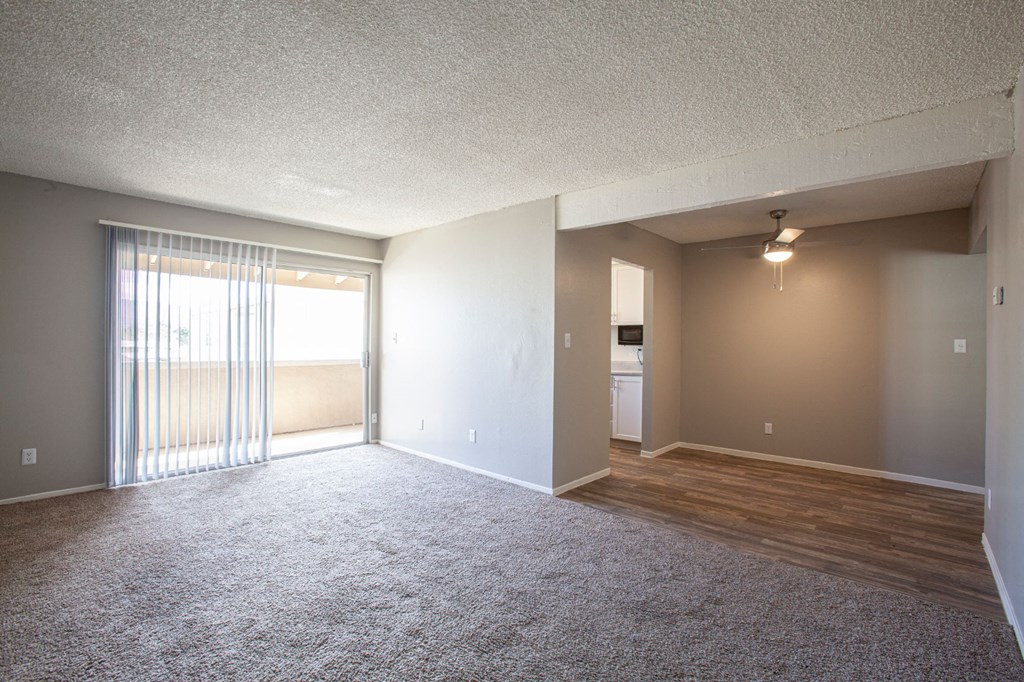 Living room and dining area at Brookwood Apartments in Tucson AZ 3-2020
