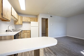Living room and kitchen at Comanche Wells Apartments in Albuquerque NM October 2020 - Photo Gallery 6
