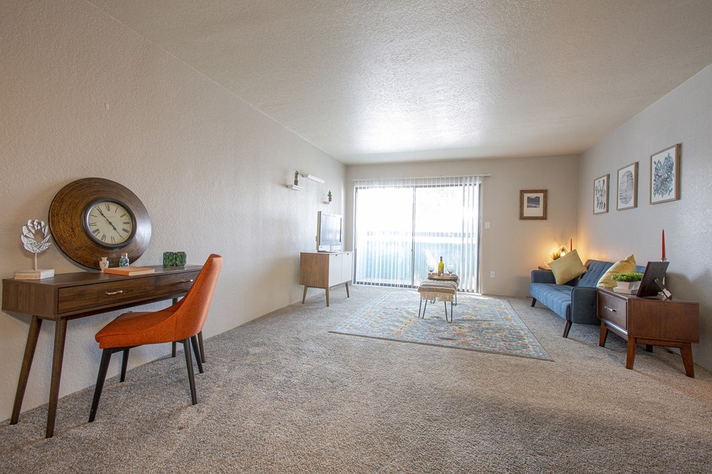 Living room and work area with sliding door at Villas Del Cielo Aprartments in Albuquerque New Mexico October 2020