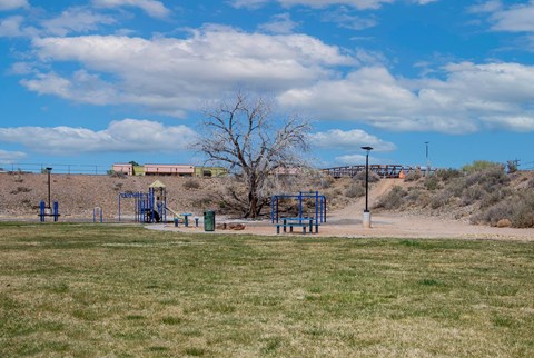 Playground and Grass Area at Villa Esperanza Apartments in Albuquerque