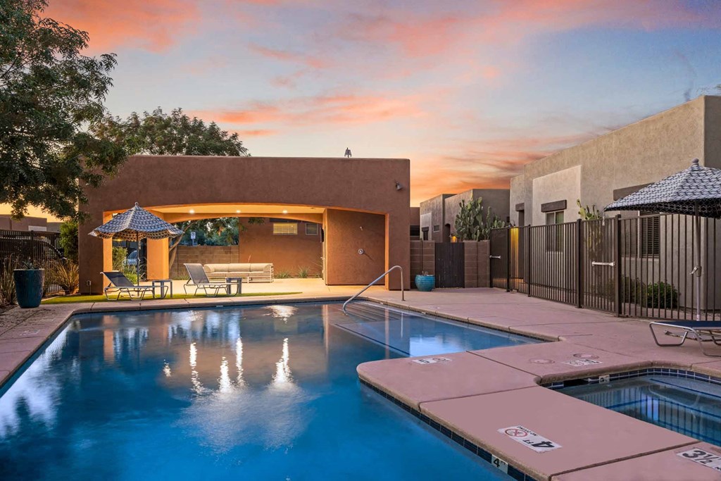 the pool at sunset at a house with a swimming pool