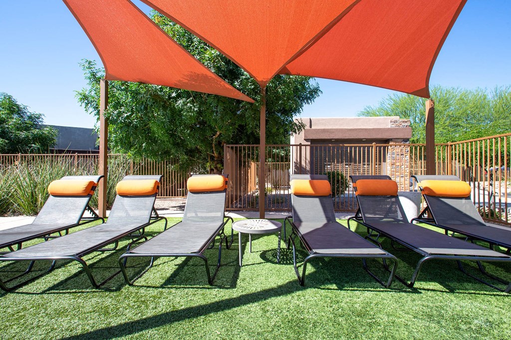Resort pool seating at Sabino Vista Apartments in Tucson