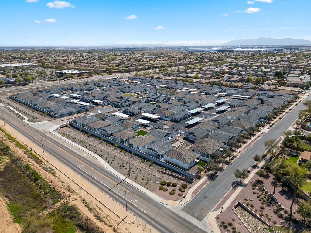 A large, modern housing development with multiple buildings and roads.