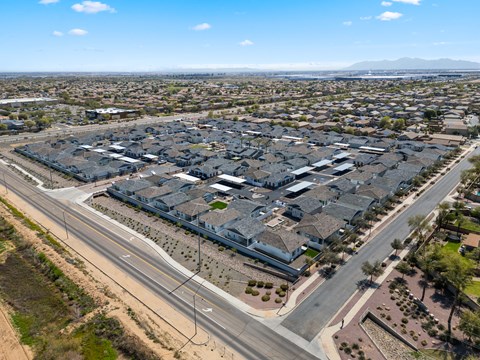 A large, modern housing development with multiple buildings and roads.