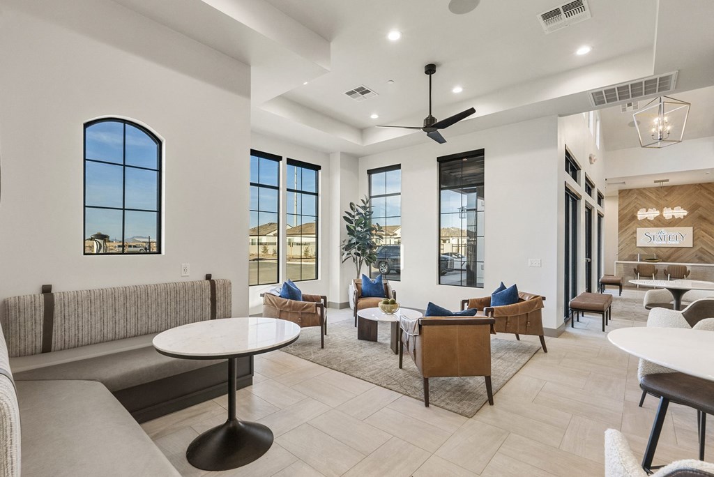 A living room with a white ceiling and a large window.