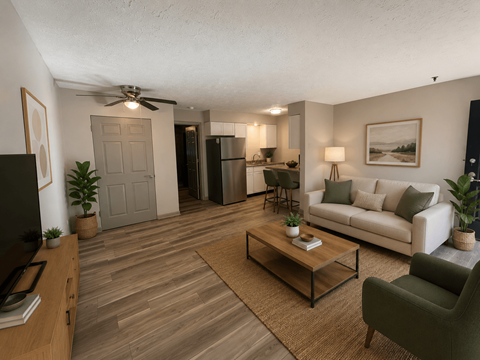 A living room with a couch, chair, and coffee table.