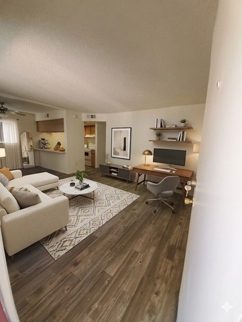 A living room with a couch, a chair, a coffee table, and a television.