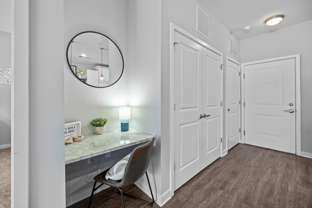 A small room with a desk and a chair.