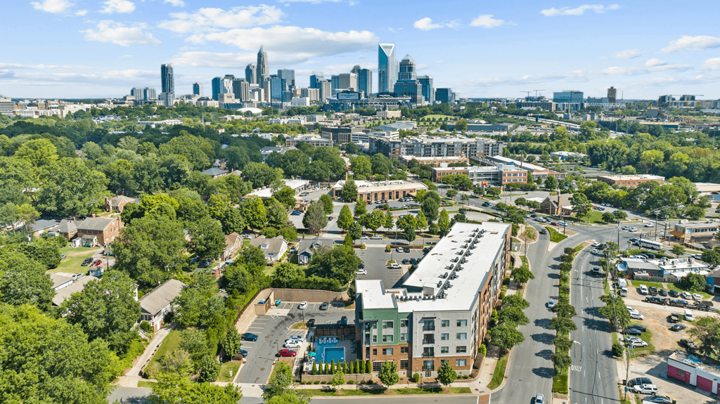 A cityscape with a mix of residential and commercial buildings.