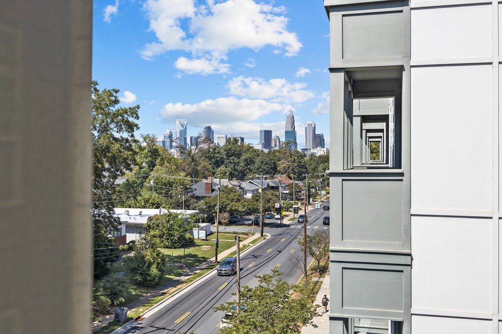 A view of a city skyline from a high-rise building.