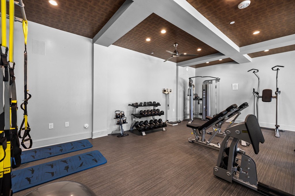 A well-equipped home gym with a variety of exercise equipment.