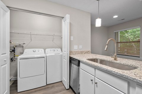 A laundry room with a washer and dryer.