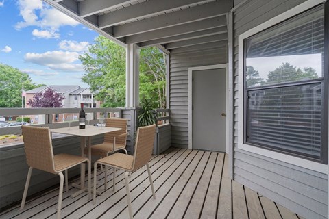 A patio with a table and chairs is shown.
