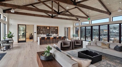 A modern living room with a large couch and a coffee table.