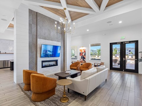 A modern living room with a fireplace and a television.
