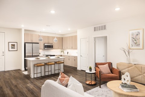 A modern kitchen with a dining table and chairs.