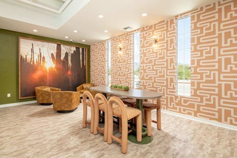 A dining room with a wooden table and chairs.