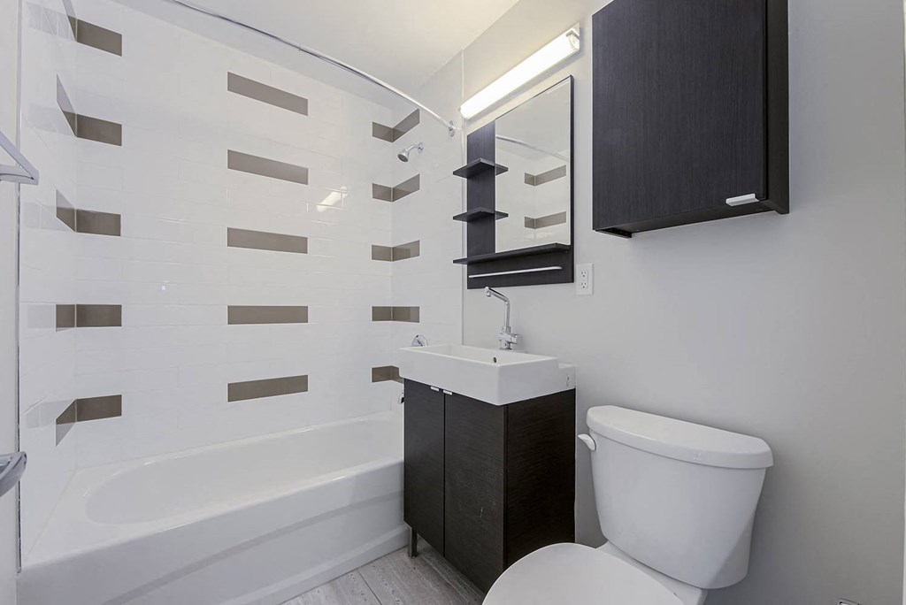 a small bathroom with a toilet and a sink at 107 Redpath, Toronto