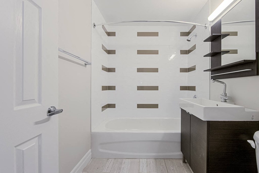 a small bathroom with a shower and a sink at 107 Redpath, Canada, M4S 2J9