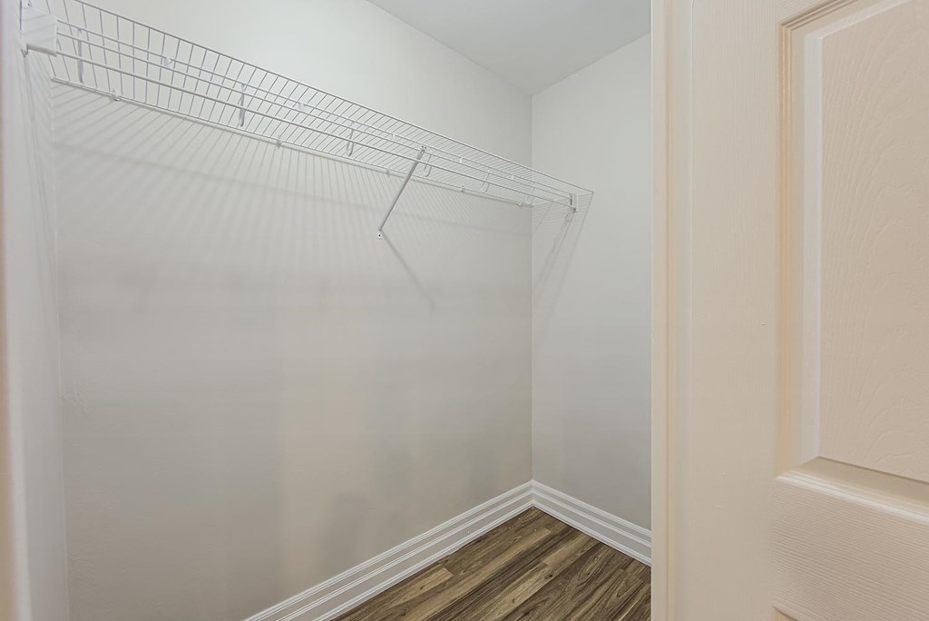 a spacious closet in a bedroom with a wood floor and white walls at 107 Redpath, Canada, M4S 2J9