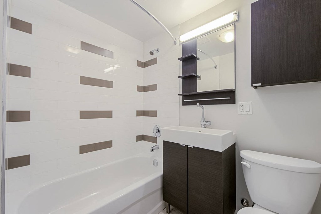 a bathroom with a toilet sink and tub at 107 Redpath, Toronto, CA M4S 2J9