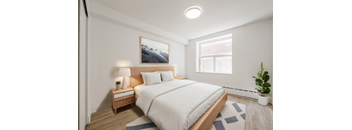 A bedroom with a bed, nightstand, and a painting on the wall. at 111 Cosburn, East York, ON