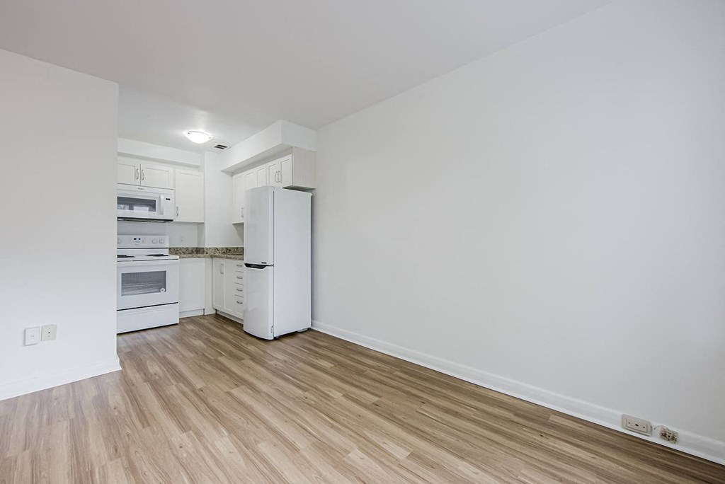 a kitchen with a refrigerator and a stove and at 161 St. George, Canada