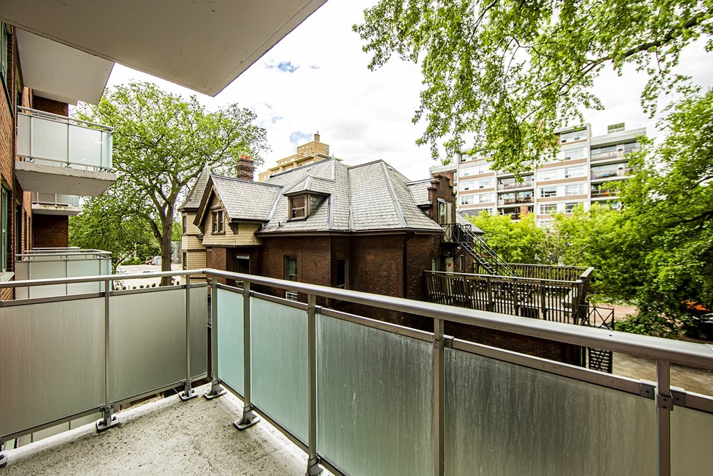 a small house on a balcony with a balcony fence at 161 St. George, Toronto, M5R 2M3