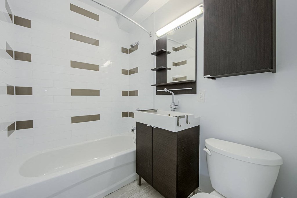 a small bathroom with a toilet and a sink at 161 St. George, Toronto, CA