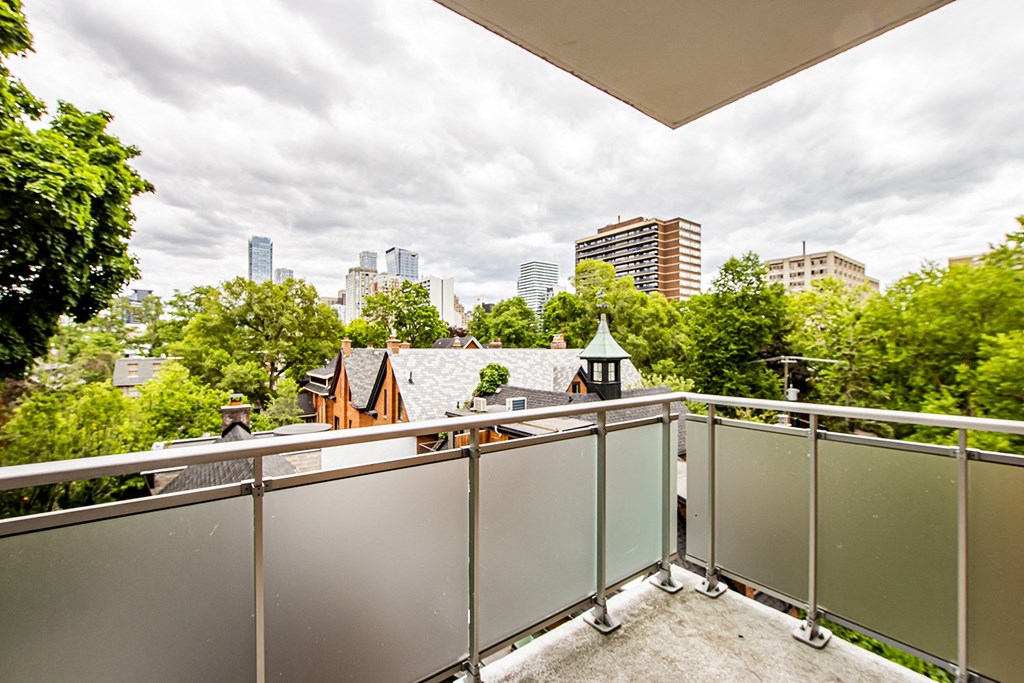 a balcony with a view of the city in the distance at 161 St. George, Canada