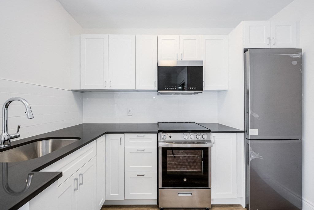 a kitchen with white cabinets and stainless steel appliance at 608 Church Apartments, Toronto, M4Y 2E7