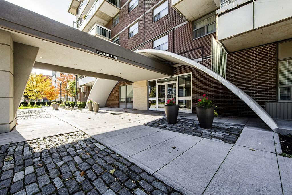 an entrance to a brick building with a staircase and a courtyard at 70 Park, Canada, L5G 1M5
