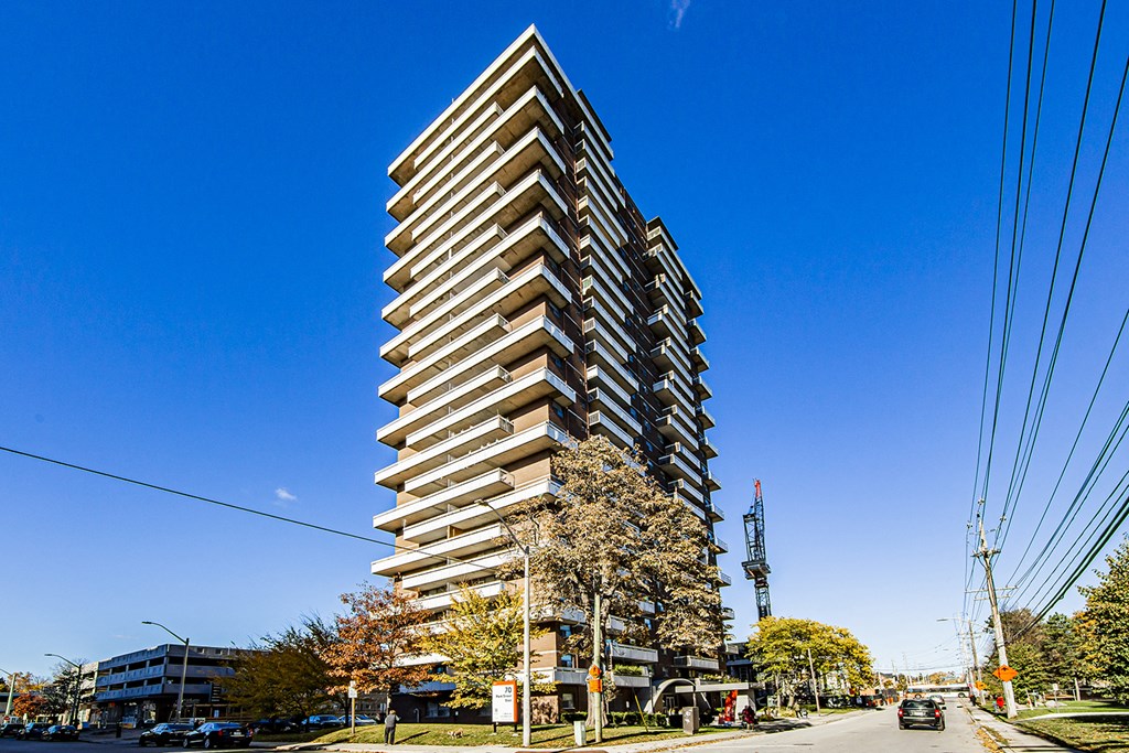 a tall building on a city street with a blue sky at 70 Park, Canada, L5G 1M5