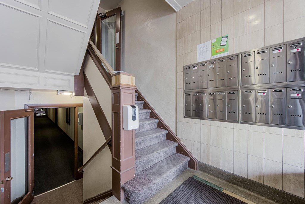 the stairs and lockers in a hallway of a building