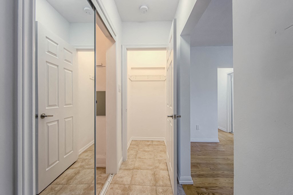 a renovated hallway with a closet and a door to a bathroom at 83-85 Silver Birch, Canada