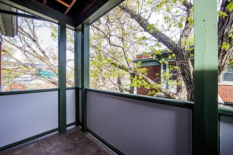 a screened in porch with a tree out the window at 83-85 Silver Birch, Toronto, CA