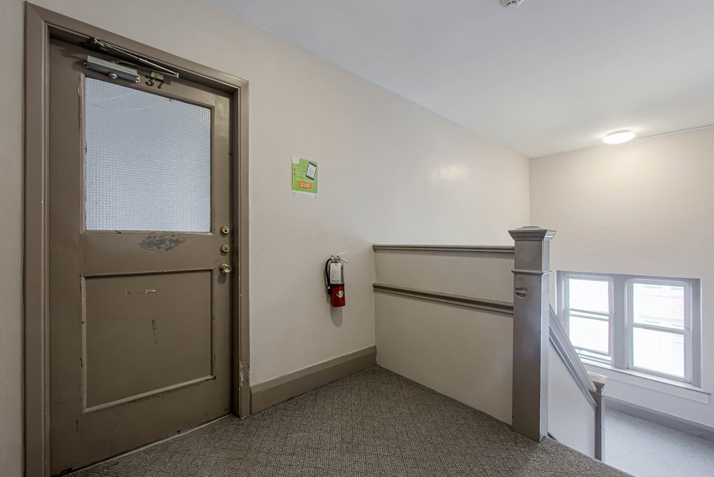 a room with a door and a window and a staircase at 83-85 Silver Birch, Canada