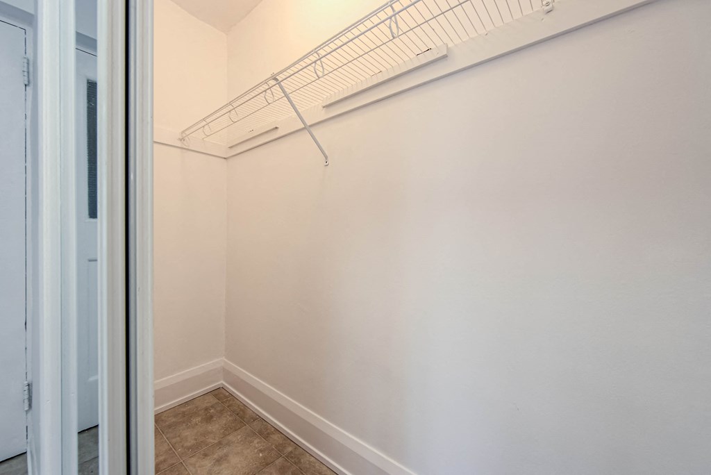 an empty closet in a bedroom with white walls and a white door at 83-85 Silver Birch, Toronto, CA