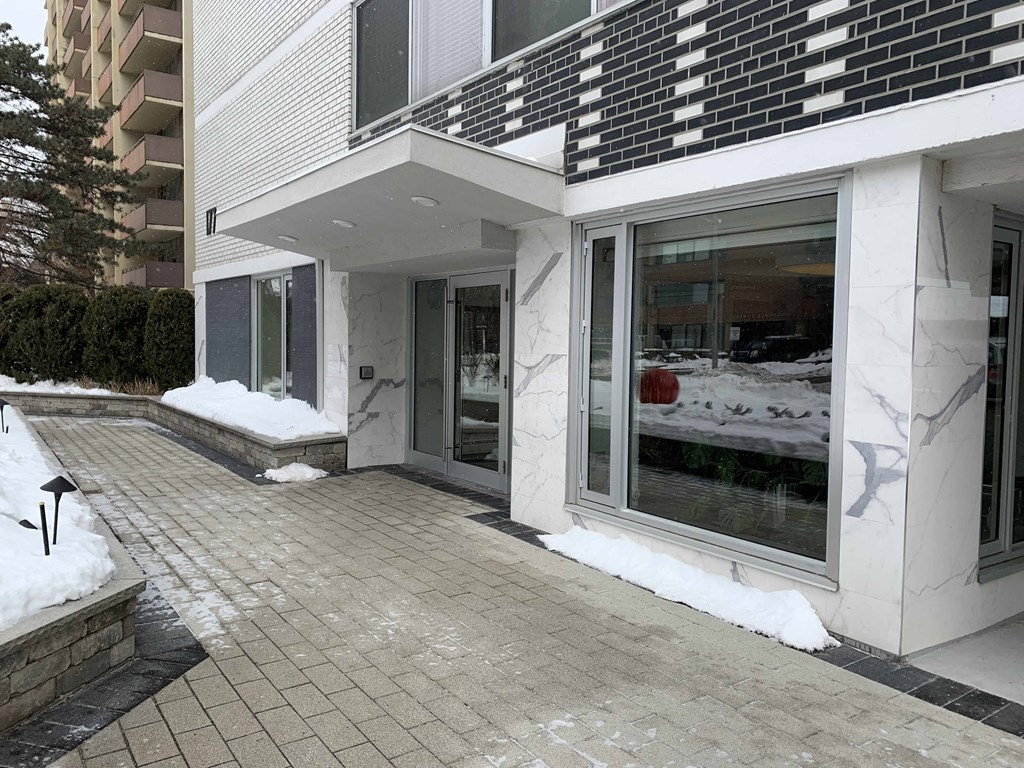 the building where the hotel is located is covered in snow