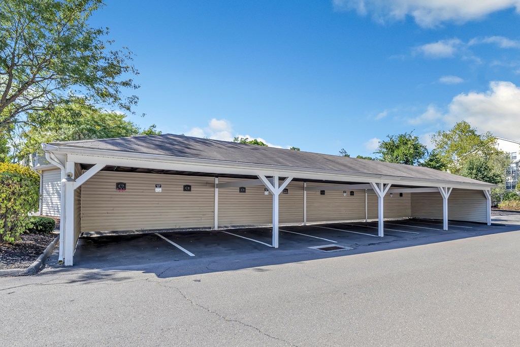 A large, covered parking structure with multiple garage doors.