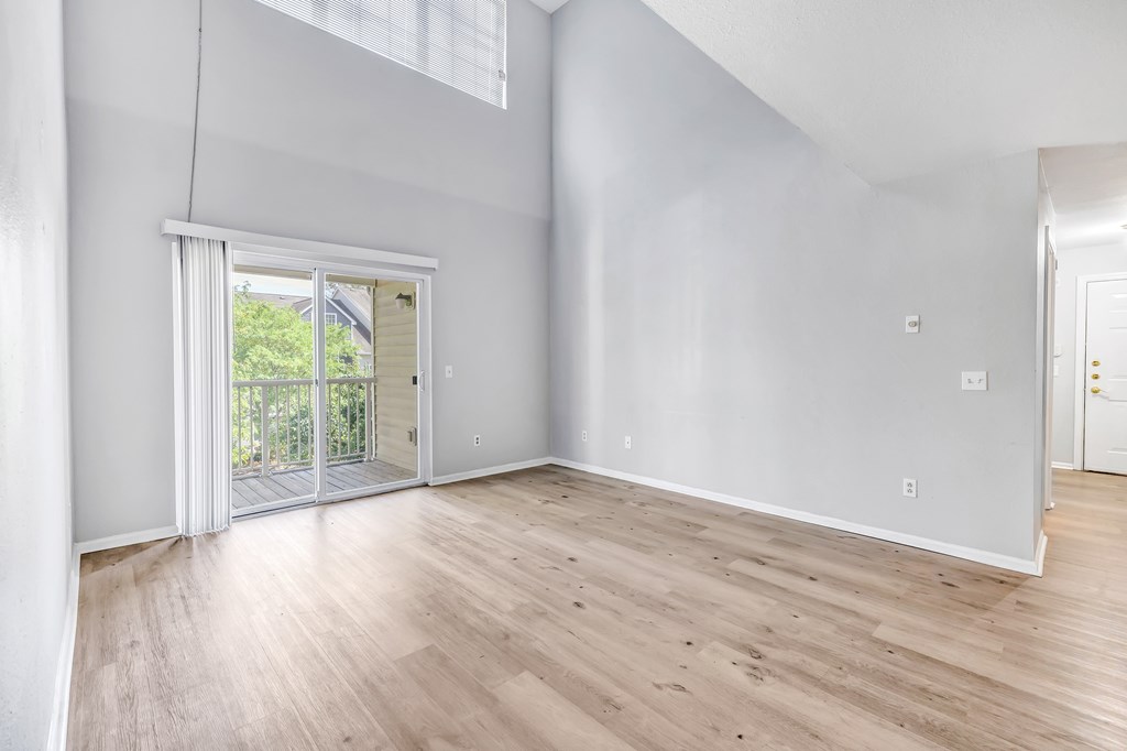 A room with wooden floors and white walls.