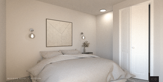 a small bedroom with a bed and a nightstand
