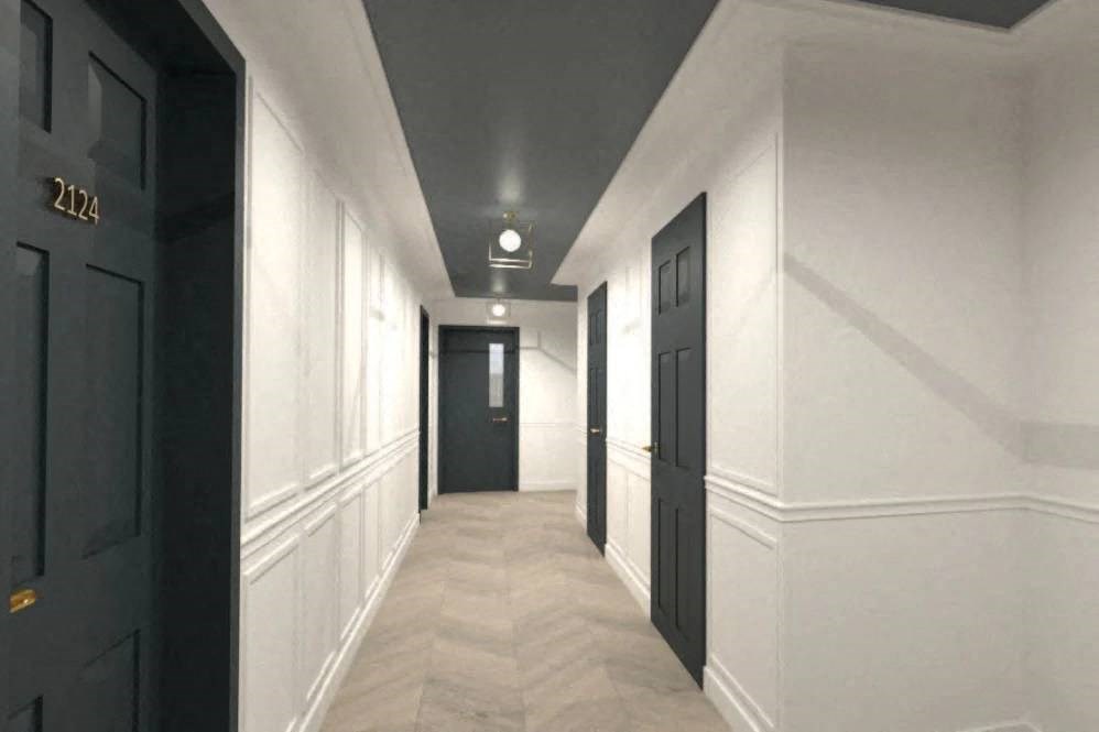 a hallway with black doors and white walls and a tile floor