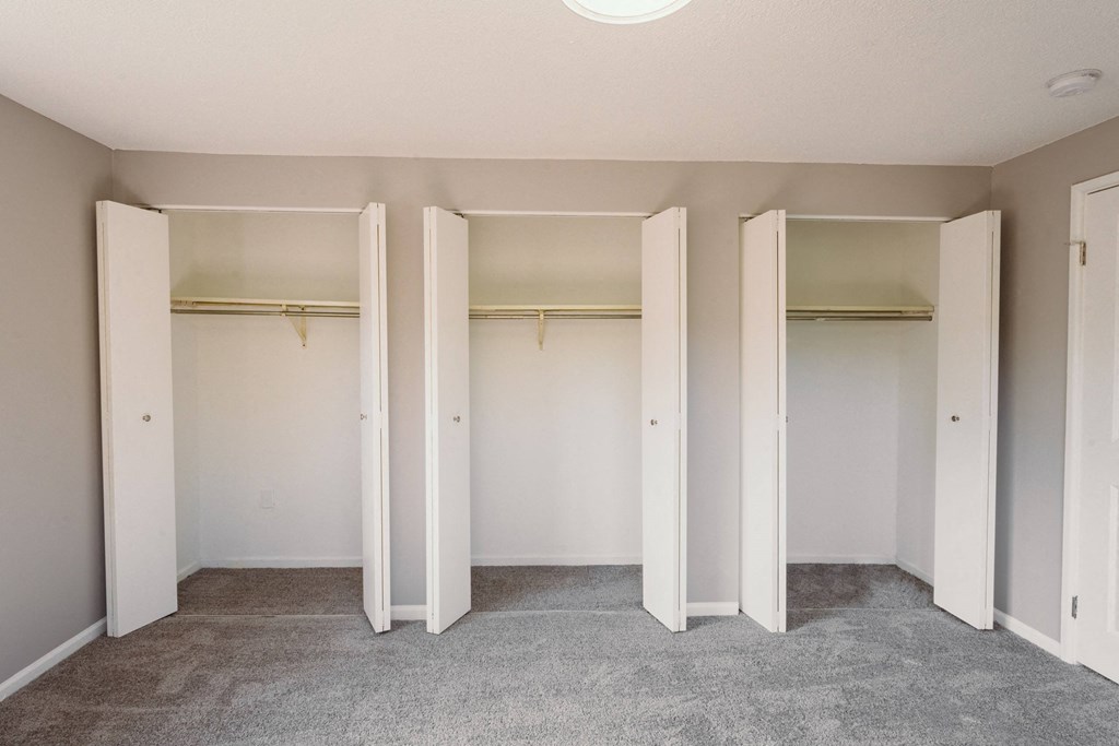 an empty closet in a home with hanging racks at BAY SHORE APARTMENTS, EAST HAVEN, 06512