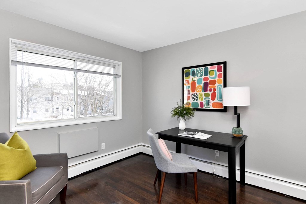 a living room with a couch and a desk and a window at Encore 99, Connecticut, 06512